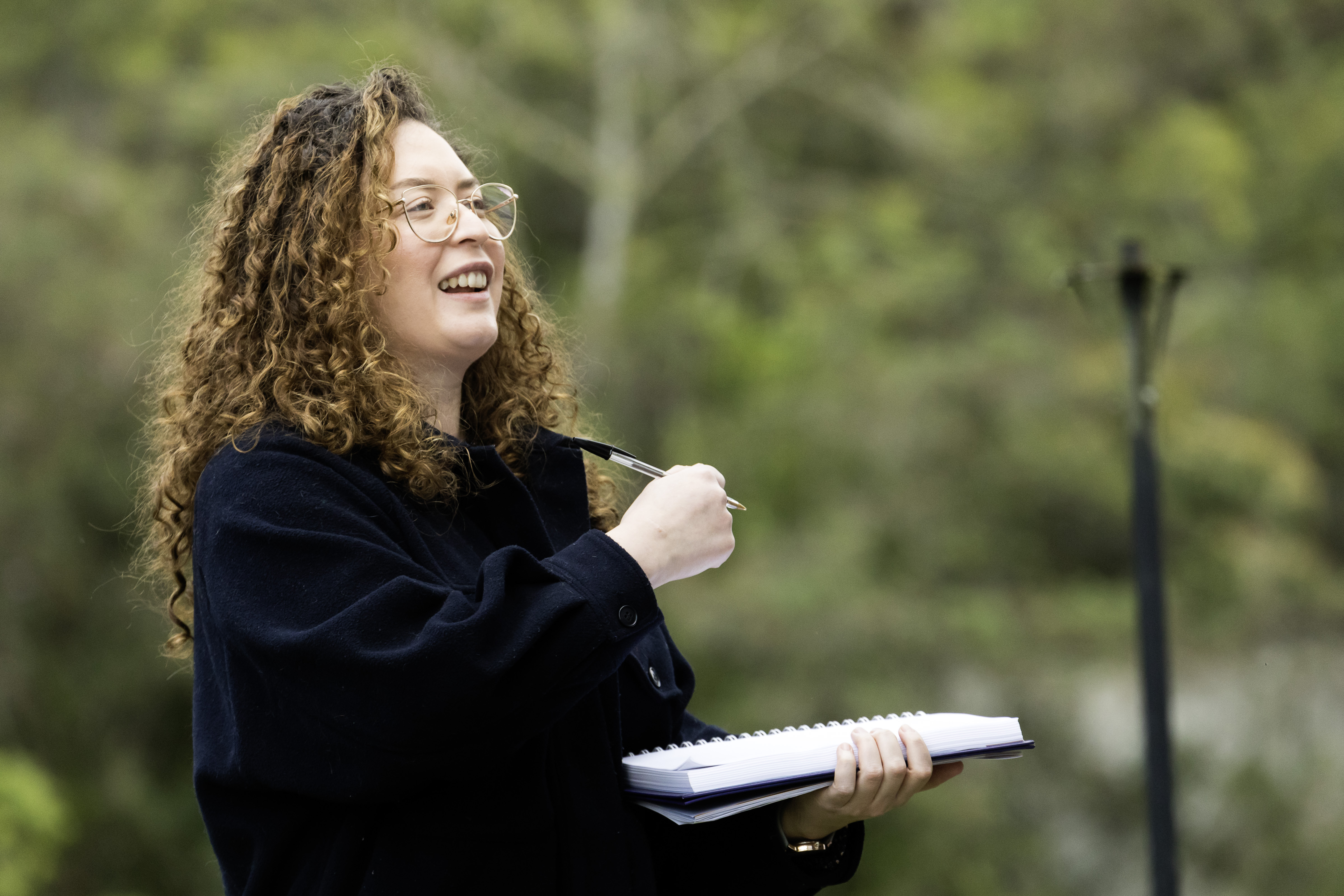Francis Gagliardi outdoors with notebook